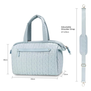 Quilted baby diaper bag in light blue with adjustable strap and 43x30x15cm dimensions