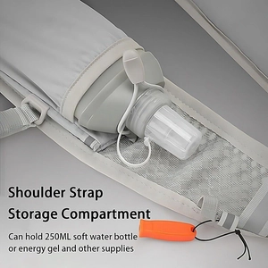 Detail view of hydration vest shoulder strap with 250ml flask pocket and orange whistle