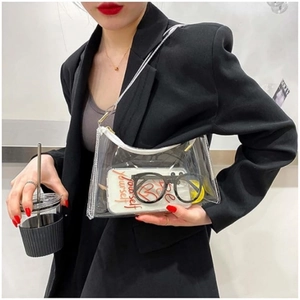 Transparent PVC crescent jelly bag styled as a minimalist underarm bag for women