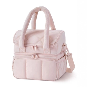 Detail showing dual layer quilted lunch bag with adjustable shoulder strap and mesh side pocket
