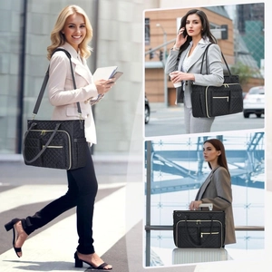 Quilted black commuter tote bag with gold zippers and multi-pocket functional design