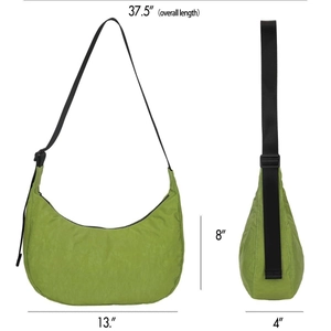 Light green crescent nylon crossbody bag with adjustable strap and size dimensions