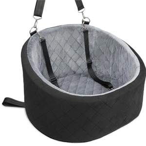 Detail of a portable pet car booster seat with quilted fabric and plush interior lining