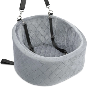 Detail view of grey velvet car pet seat featuring diamond quilting and safety straps