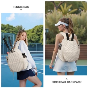 Cream quilted tennis backpack showing functional dual racket storage and side mesh pockets