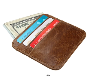 Detail view of vintage brown crazy horse leather card holder with multiple card slots