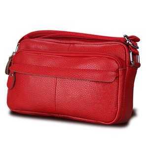 Red lychee grain leather crossbody bag featuring multiple zipper compartments and silver hardware