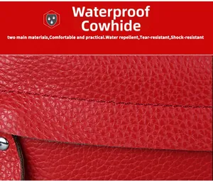 Detail of red waterproof cowhide leather with lychee texture and reinforced stitching