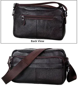 Detail of dark brown leather messenger bag featuring multiple zippers and adjustable strap
