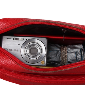 Red lychee grain leather crossbody bag with spacious interior and internal zipper pocket