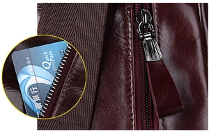 Makroaufnahme von Premium-Leder mit präzisen Nähten und Metall-Reißverschluss-Detail