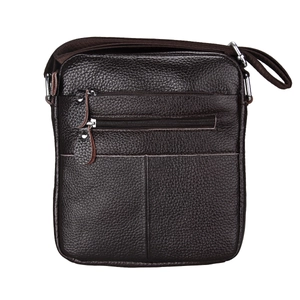 Detail of dark brown pebble leather texture and silver zippers on men's crossbody bag