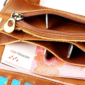 Close-up of brown genuine leather wallet showing multi-slot interior and zipper pocket