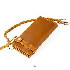 Side view of leather long wallet with braided security chain and metallic buckle