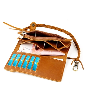 Interior detail of vintage leather wallet showing card slots and zipper compartment