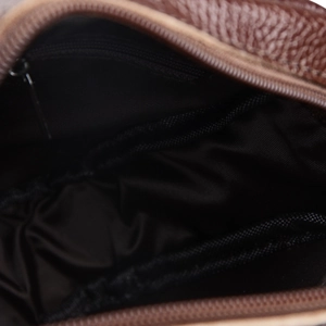 Internal view of brown leather messenger bag with zipper pocket and fabric lining