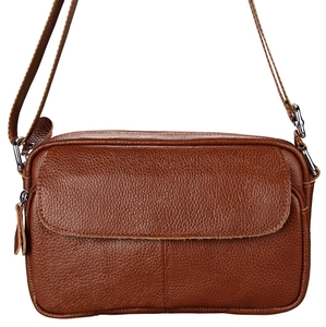 Detailed close-up of dark brown pebble grain leather surface and silver metal hardware