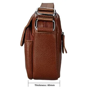 Side view of brown lychee grain cowhide crossbody bag with 80mm multi-layer storage detail
