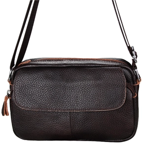 Close-up of deep brown leather shoulder bag with lychee texture and silver hardware