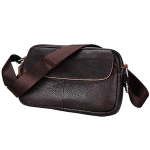 Close-up of deep brown lychee grain cowhide leather surface and precise stitching details