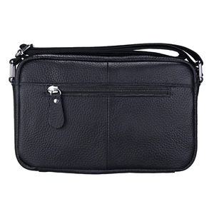 Macro detail of black litchi grain leather shoulder bag with rear zipper pocket and strap