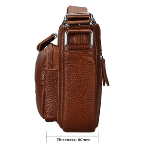 Side view of brown lychee grain leather crossbody bag showing 80mm width and texture