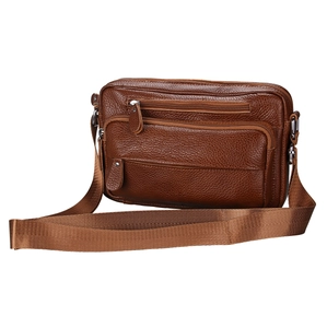 Detailed close-up of brown leather messenger bag with multiple zippers and wide strap