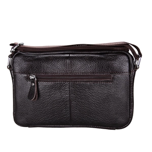 Close-up of brown litchi grain leather shoulder bag with metal zipper and strap