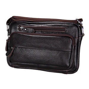 Detailed close-up of brown leather crossbody bag with multiple zipper pockets and texture