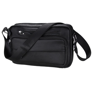 Close-up of black litchi grain leather shoulder bag with multi-zipper compartments