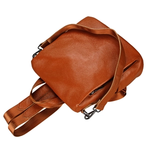 Brown top grain leather backpack with lychee texture and adjustable woven strap