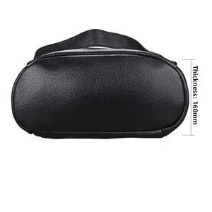 Detailed bottom view of black pebble grain leather backpack showing 160mm thickness