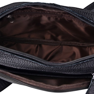 Detailed interior of black litchi grain leather shoulder bag with multiple compartments