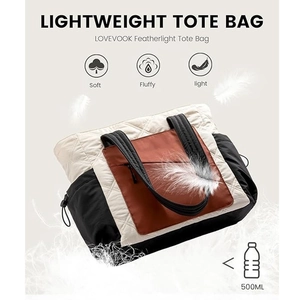 Lightweight quilted tote bag with side pockets and a soft featherlight design