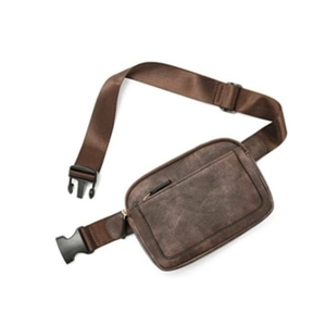 Detail of vintage brown PU leather waist bag featuring multi-zipper pockets and wide strap