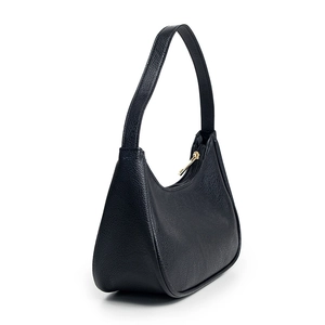 Minimalist black lychee leather hobo shoulder bag with a gold zipper on white background