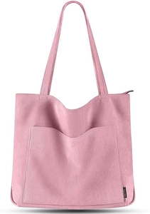 Detail einer pinkfarbenen Cord-Einkaufstasche mit Logo-Etikett, Seitentasche und Reißverschluss