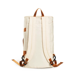 Detail view of cream travel garment bag backpack with contrast orange straps and sturdy buckles