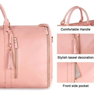 Pink travel bag detail showing soft PU leather, tassel charm, and smooth metal zipper