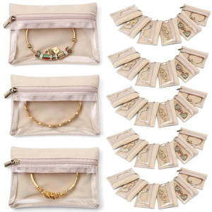 Set of beige velvet jewelry zipper bags with PVC windows for accessory storage