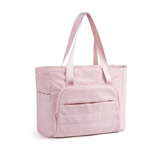 Detailed view of the pink quilted tote bag with side pockets and smooth nylon texture