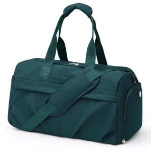 Detail view of the forest green travel bag with shoe compartment and waterproof material