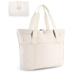 Detail view of foldable beige canvas tote bag with snap closure and large front pockets