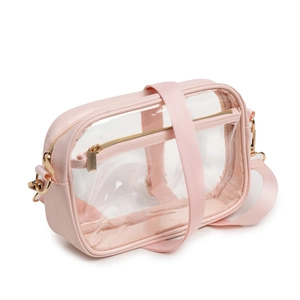 Detail of pink transparent PVC crossbody bag with adjustable strap and golden hardware
