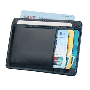 Detail of dark blue leather card holder with multiple slots and RFID protection