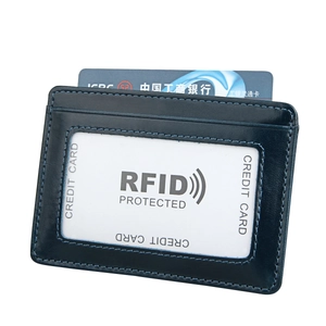 Detail of slim RFID leather wallet with clear ID window and precise blue stitching