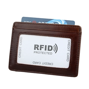 Detail of RFID blocking leather card holder with clear ID window and secure stitching