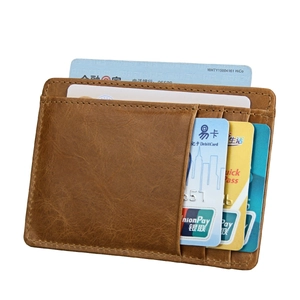 Detailed view of brown leather card holder featuring multiple slots and premium stitching