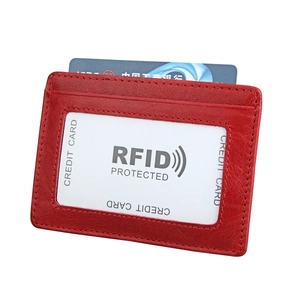 Red RFID blocking leather card holder with clear ID window and pebble grain texture