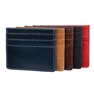 Detail of slim leather card holders in five colors with reinforced stitching and multi-slots